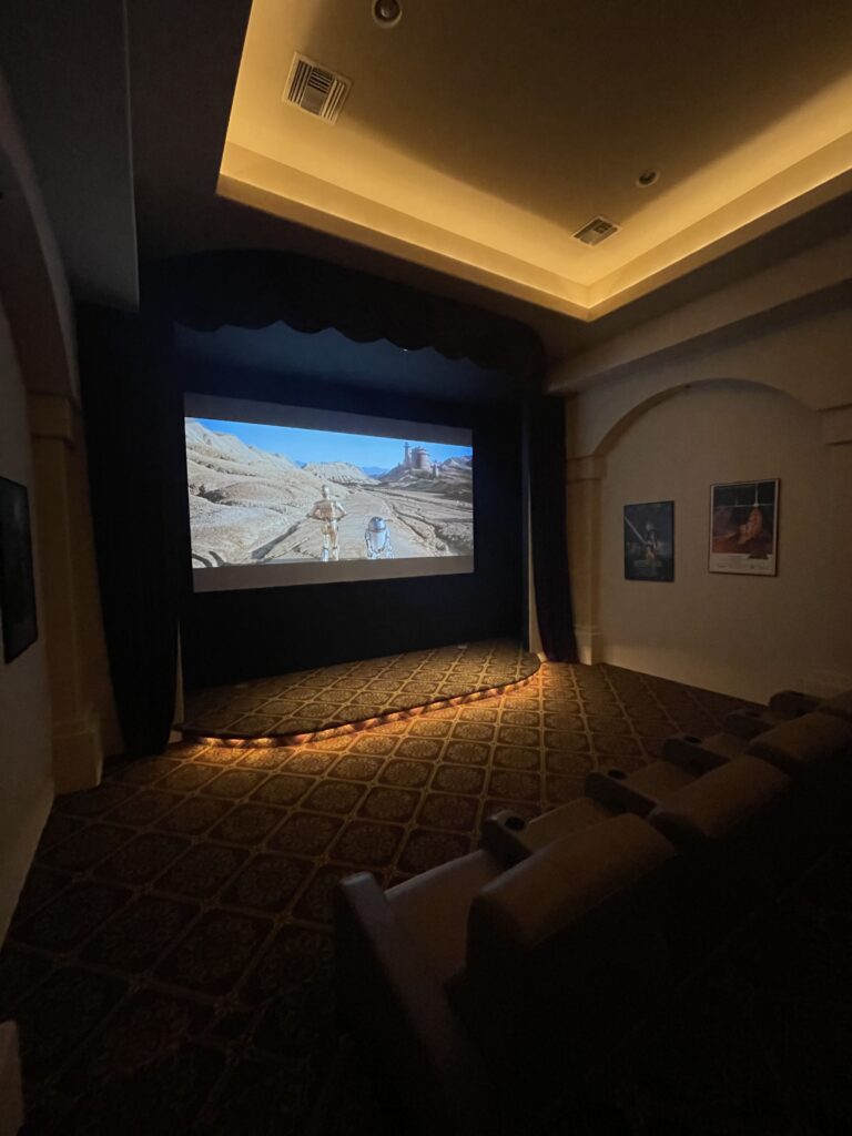 home theater with large screen and projector