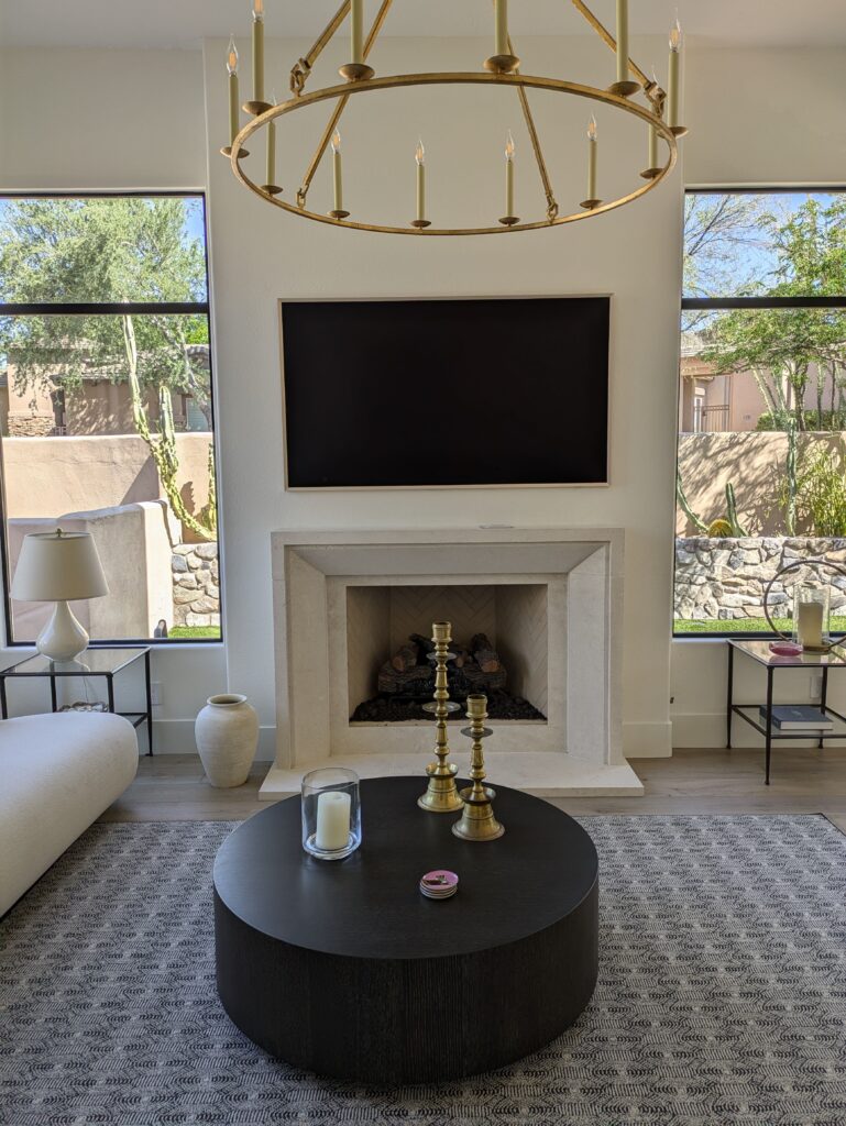 tv hanging above a fireplace